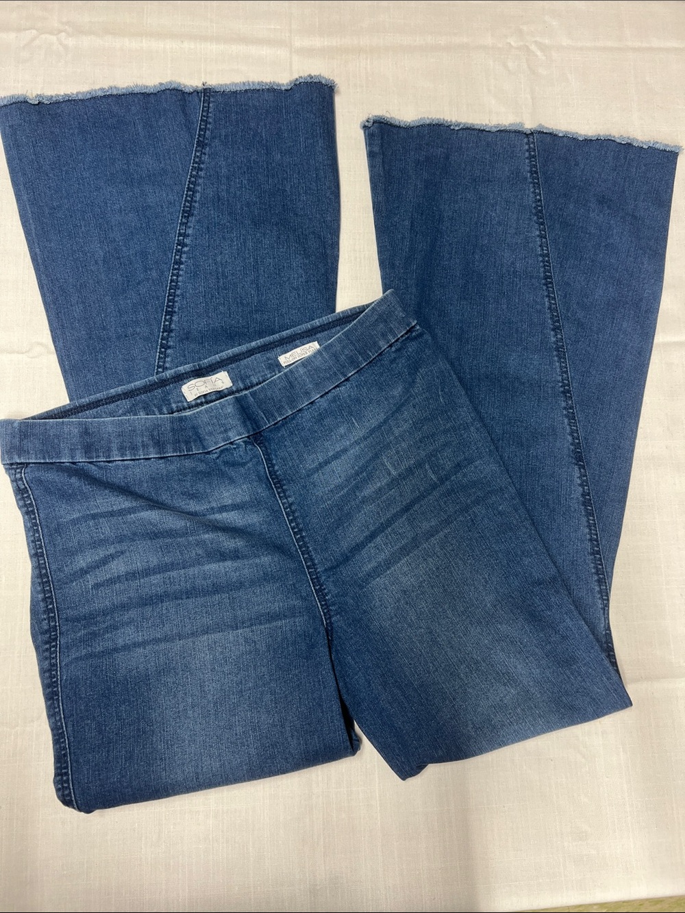 High-Rise Blue Super Flared Jeans with Raw Hem